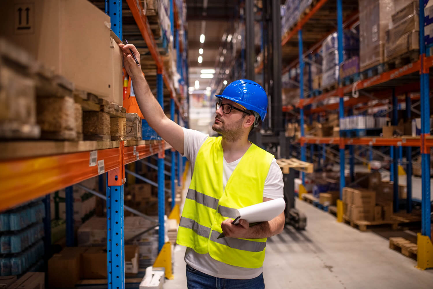 Warehouse worker checking inventory checklist